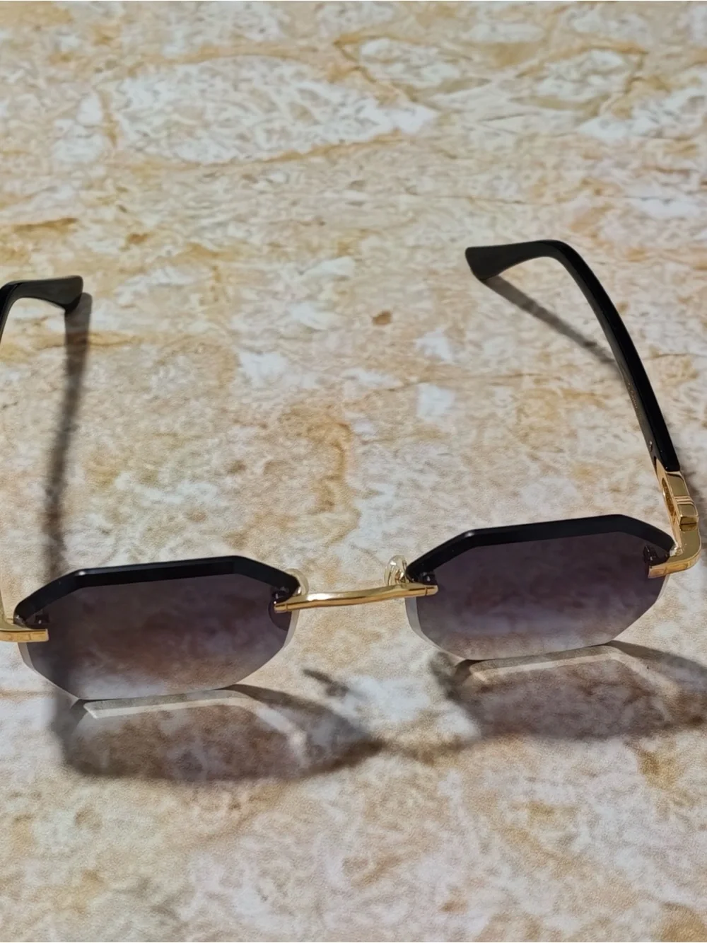 Cartier Women’s Rimless Sunglasses with Purple Gradient Lenses and Gold Accents